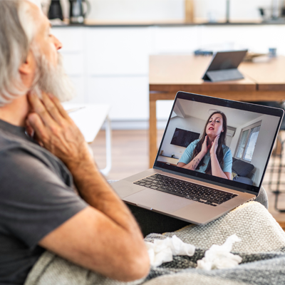 telehealth session man at home in front of screen