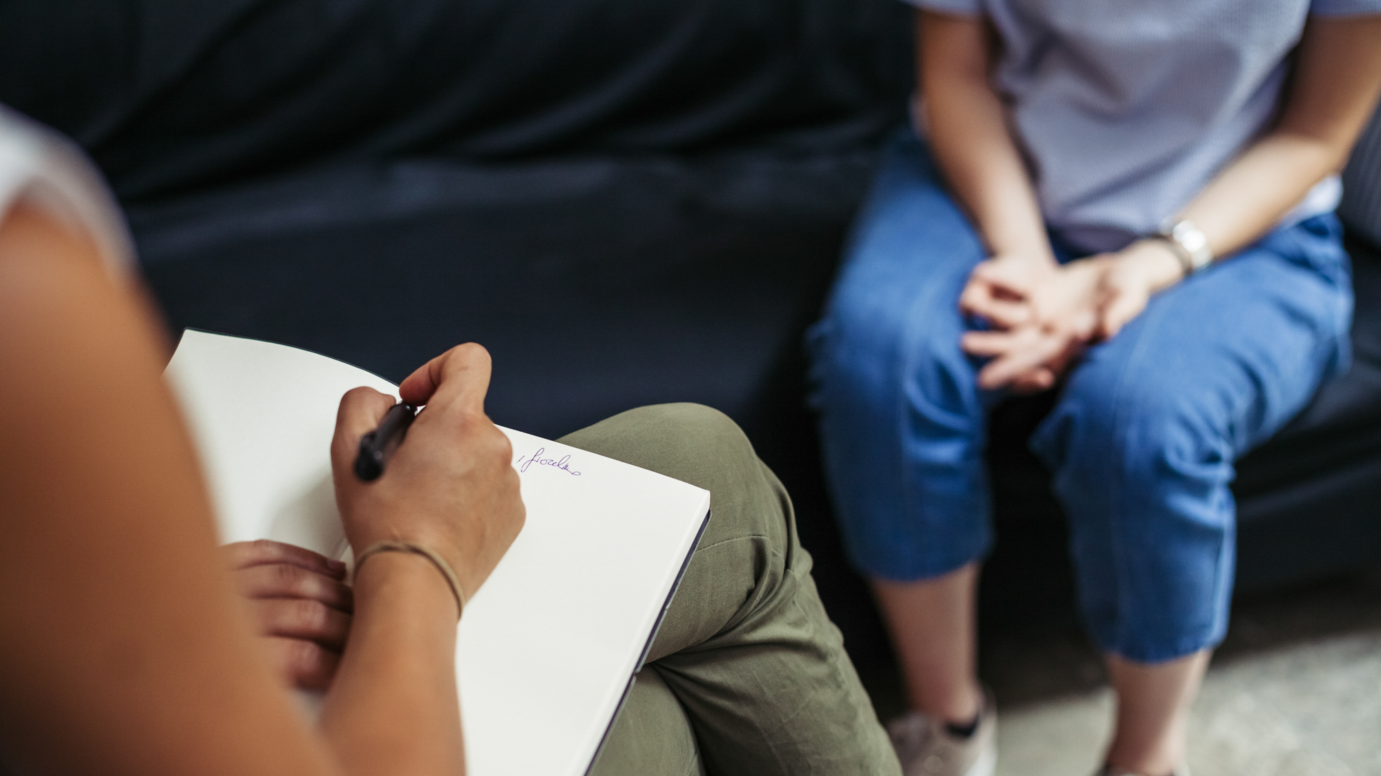 two people talking in chairs