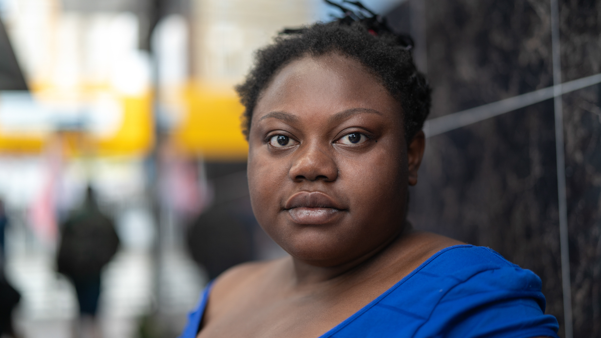 african american woman in blue shirt