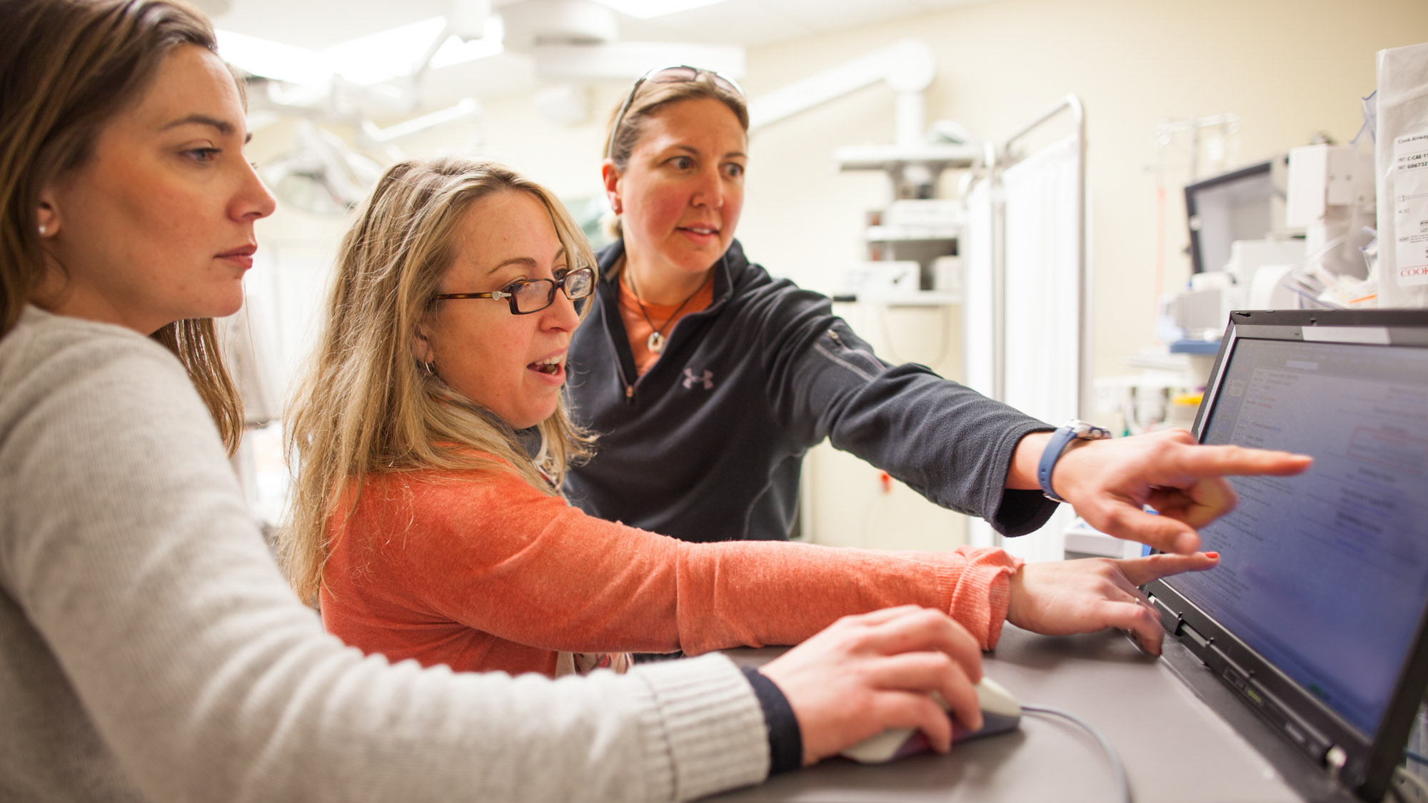 nurses look at screen