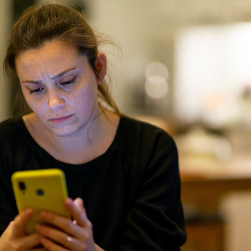 women looking at device