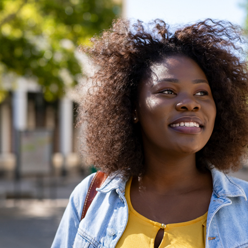 young lady smiling outside