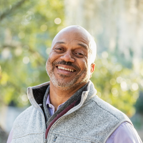 Man smiling outdoors