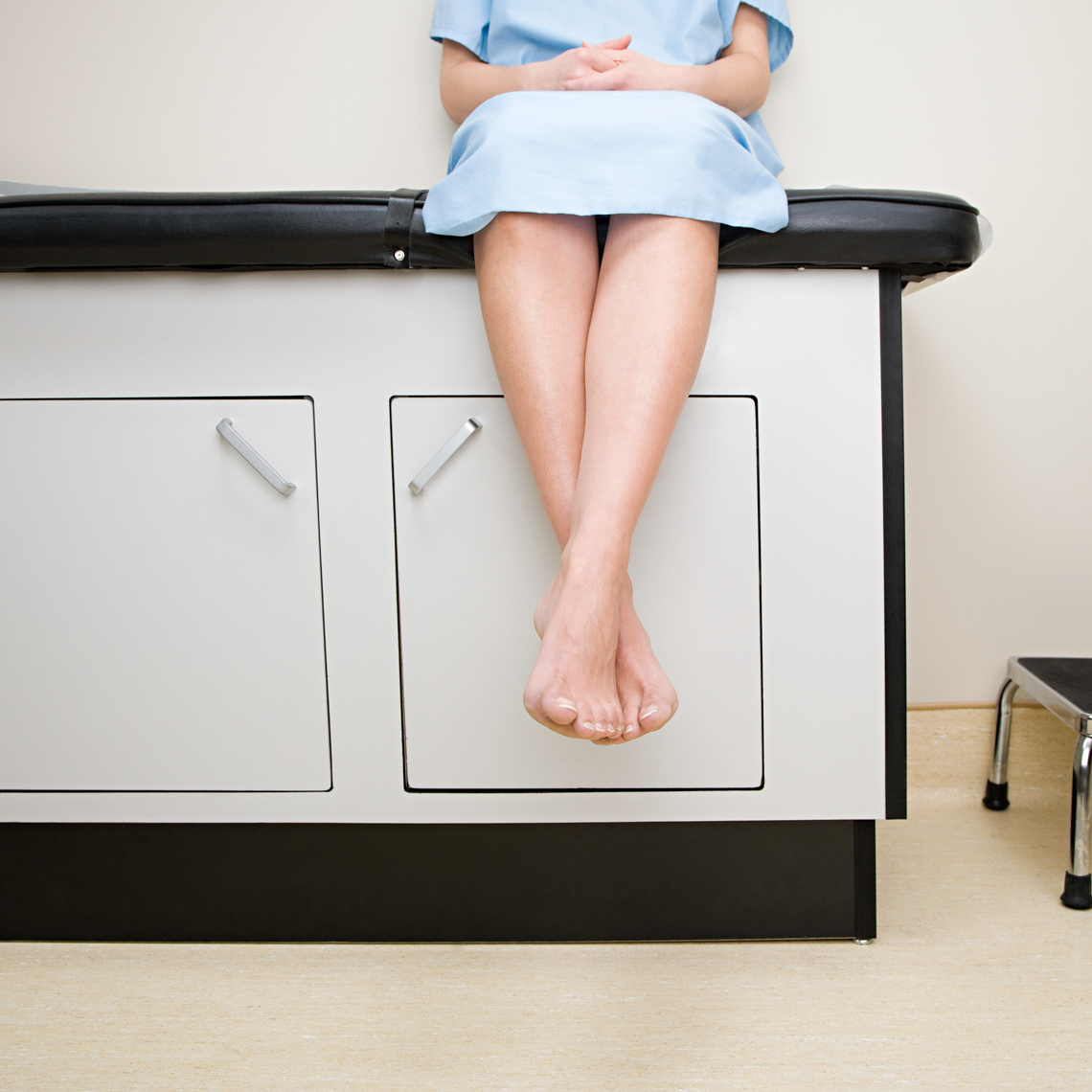 Patient sitting on treatment couch