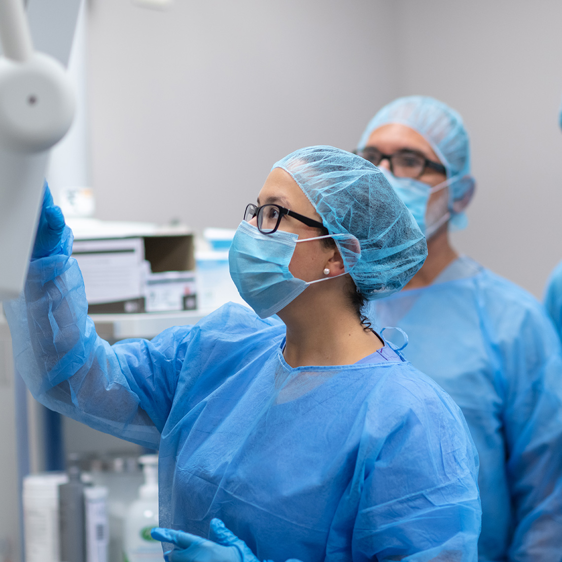 surgeons in OR checking a computer screen