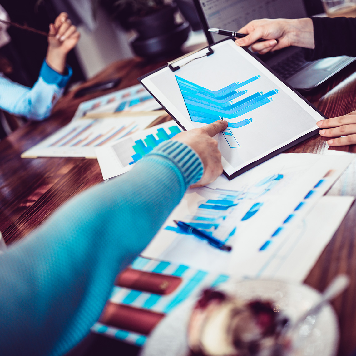 meeting table with data charts