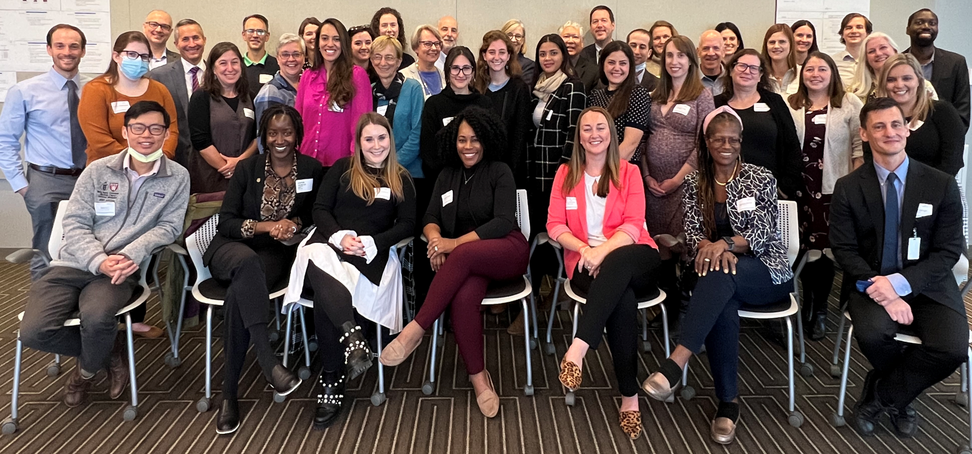 Team members pose for photo.