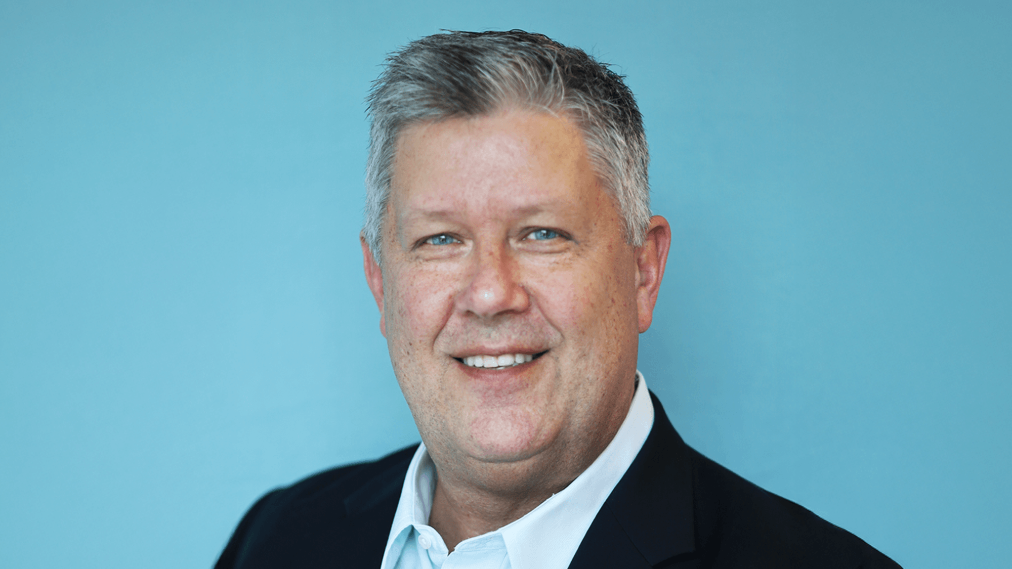 Mike P's headshot against a blue background