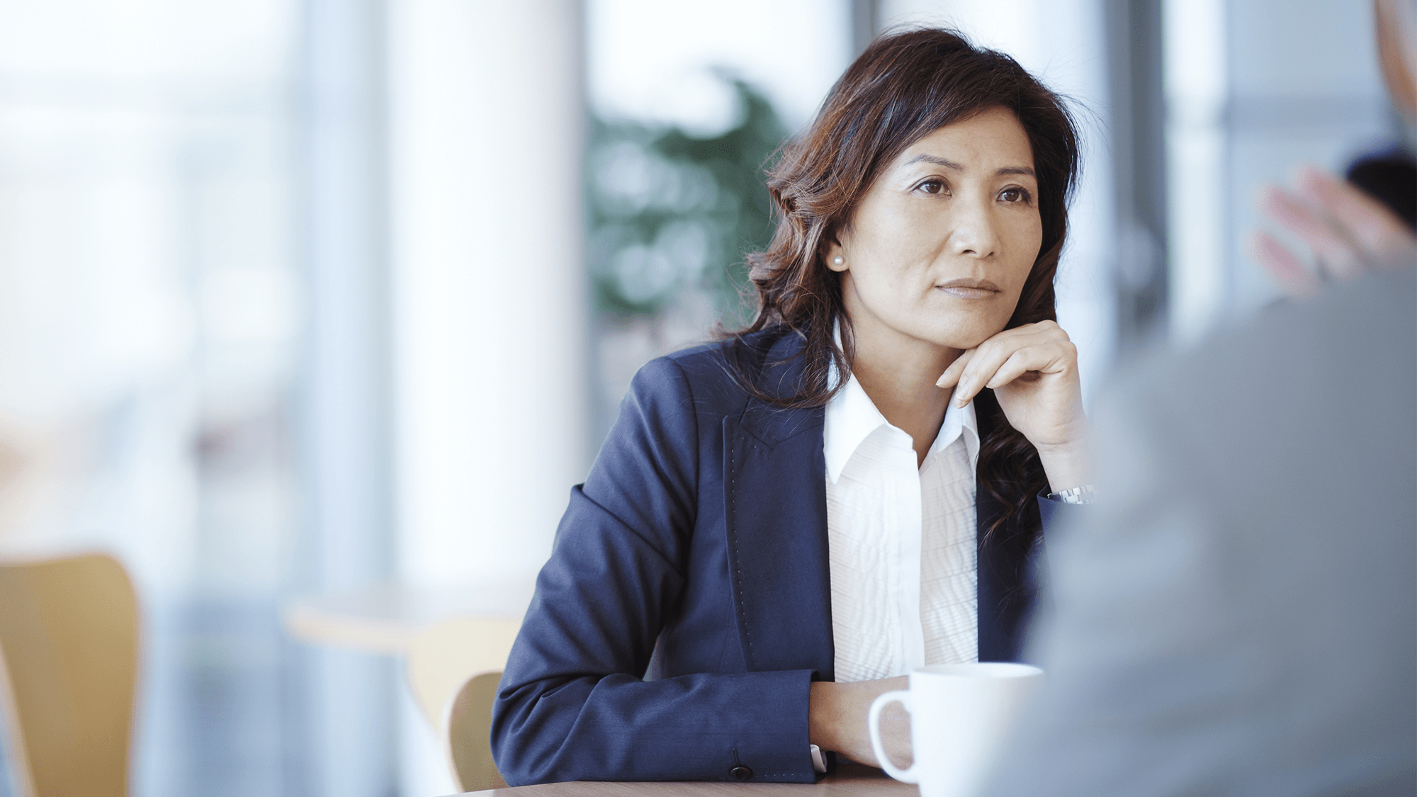 woman involved in a serious conversation with an unseen person