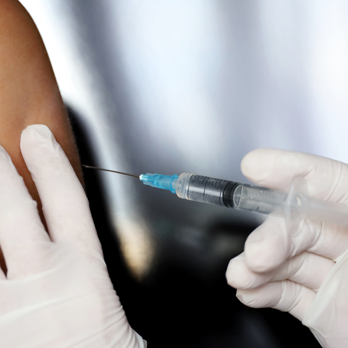 close up of injection in arm