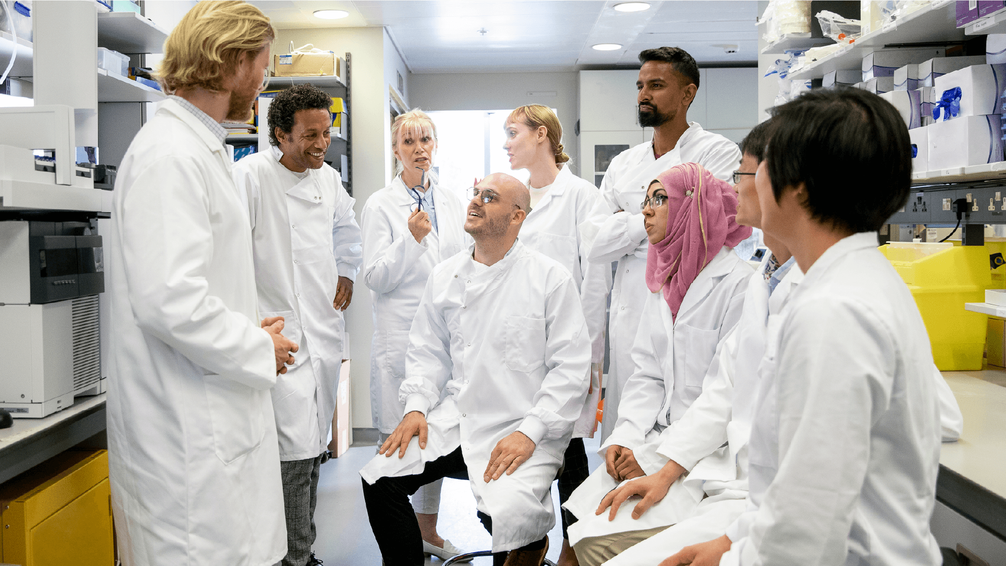 A group of lab workers chatting
