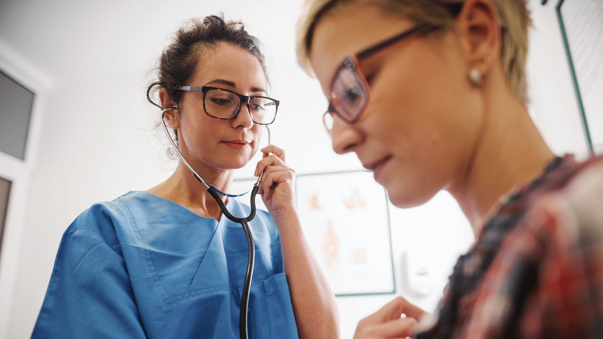 a clinician examining a patient