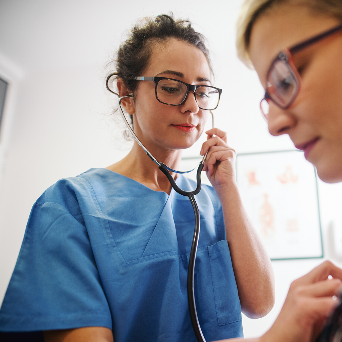 a clinician examining a patient