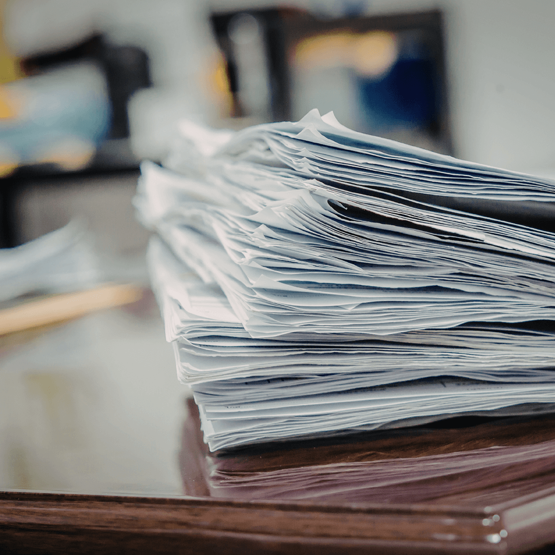 a pile of forms on a desk